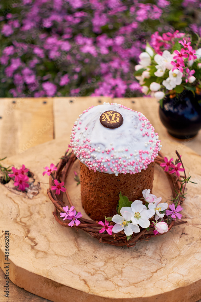 Easter cake in flowers. Side view. Easter cake in flowers. Side view.