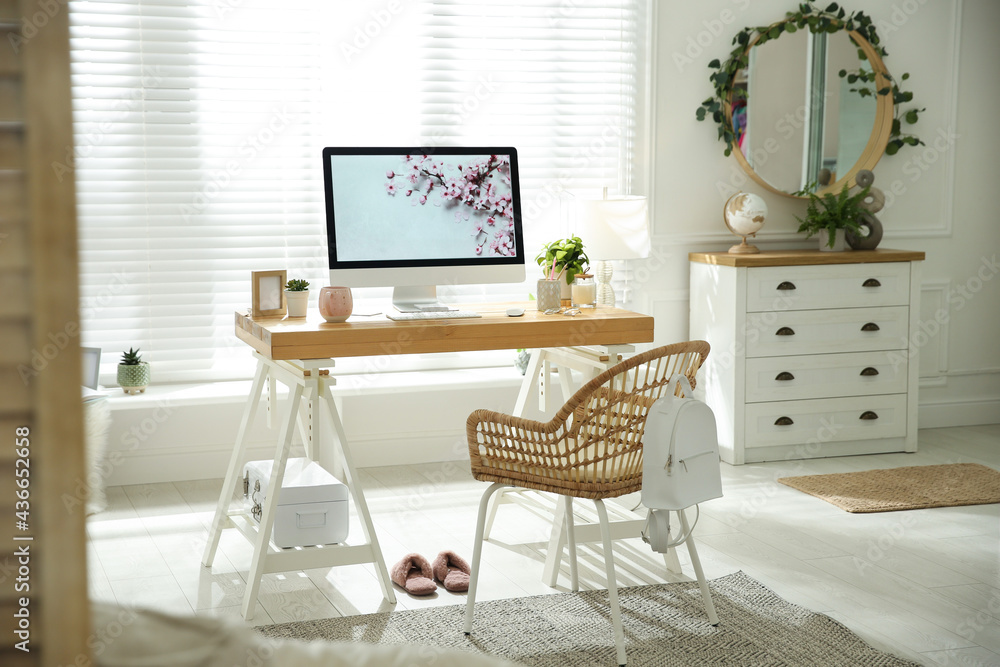 Fototapeta premium Stylish home office interior with comfortable workplace