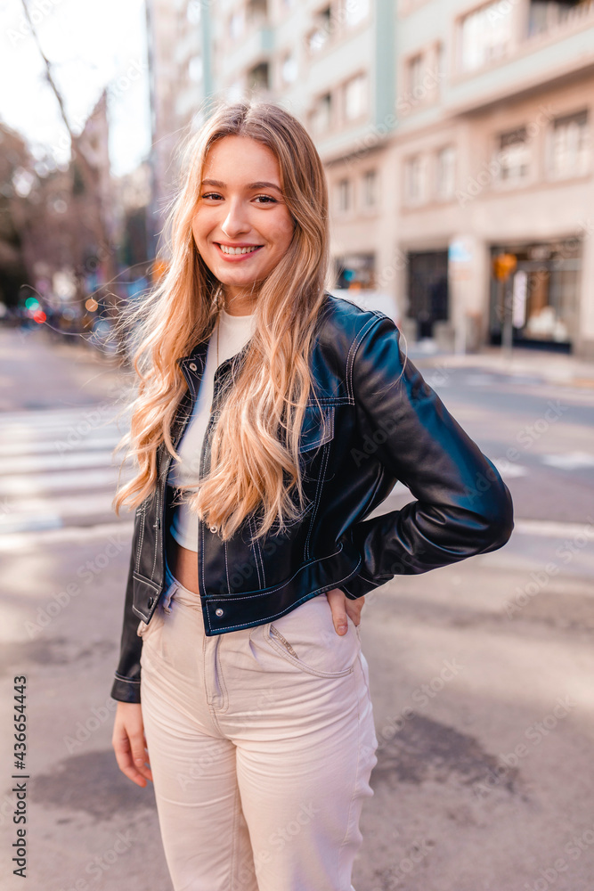 Smiling young woman on the street