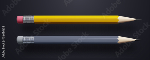 Yellow and gray pencils isolated on black background photo