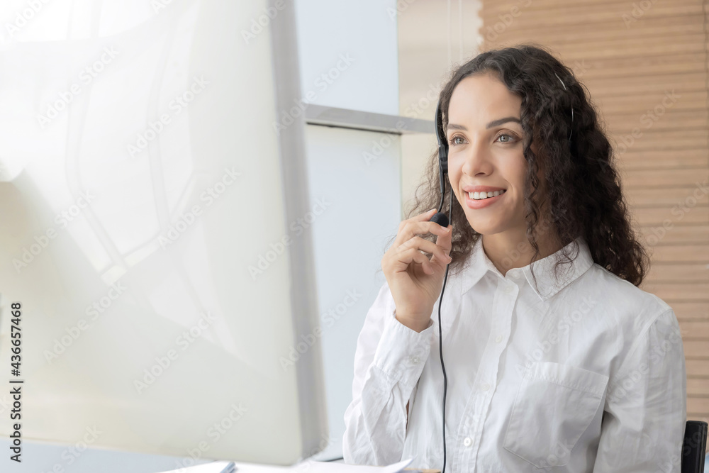 Hotline. happy young caucasian female call center customer support executive with headset working in office, education online, customer support service, call center, phone operator, video call concept Hotline. happy young caucasian female call center customer support executive with headset working in office, education online, customer support service, call center, phone operator, video call concept