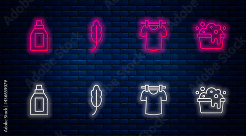 Set line Feather, Drying clothes, Bottle for cleaning agent and Basin with soap suds. Glowing neon icon on brick wall. Vector