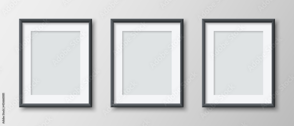 Realistic set of three vertical blank picture frame isolated on grey wall background. Empty photo frames set mockup for pictures, photograph, poster. Decorative design element interior. Vector