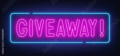 Neon sign giveaway on brick wall background.