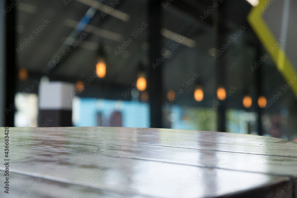 wood table on blur of cafe, coffee shop, bar, background - can used for display or montage your products wood table on blur of cafe, coffee shop, bar, background - can used for display or montage your products