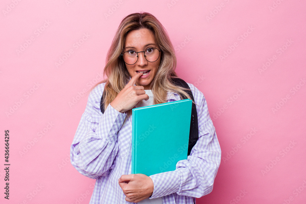 Young student australian woman isolated on pink background biting fingernails, nervous and very anxious. Young student australian woman isolated on pink background biting fingernails, nervous and very anxious.
