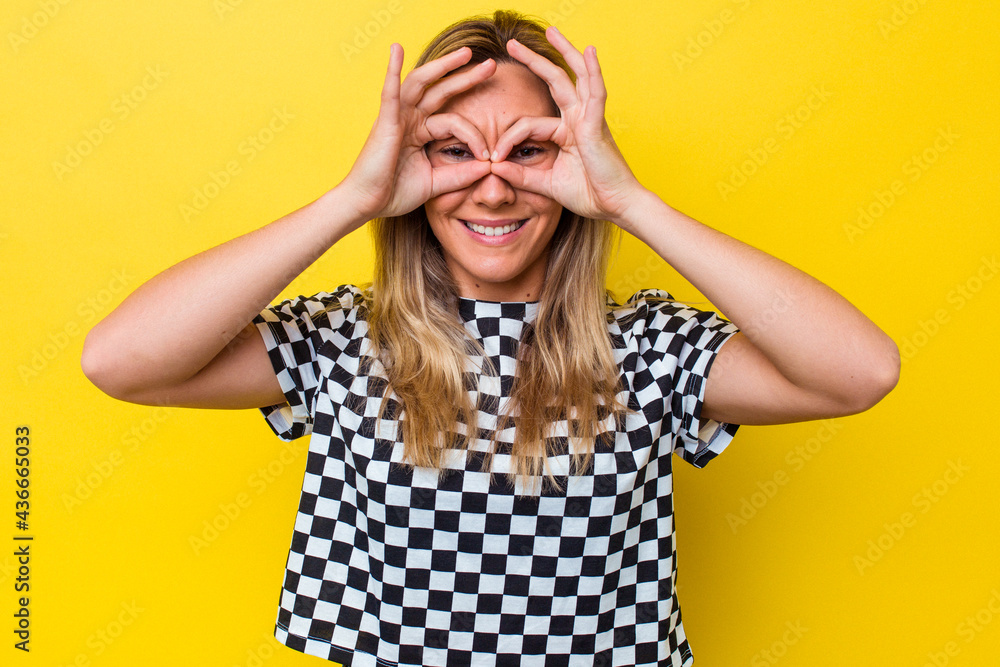 Young australian woman isolated showing okay sign over eyes Young australian woman isolated showing okay sign over eyes