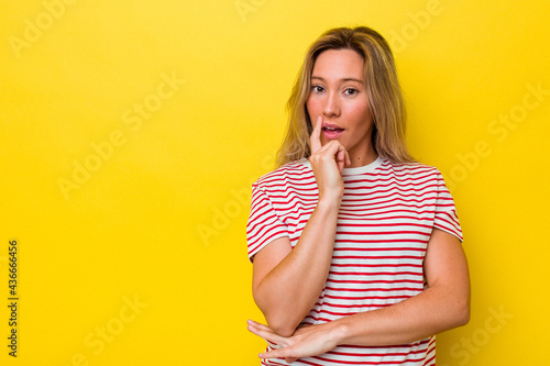 Young australian woman isolated looking sideways with doubtful and skeptical expression.