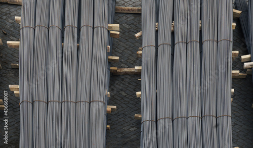 Vertical lines of gray melancholy wires on horizontal lines of wooden planks, At Leixoes in Portugal photo