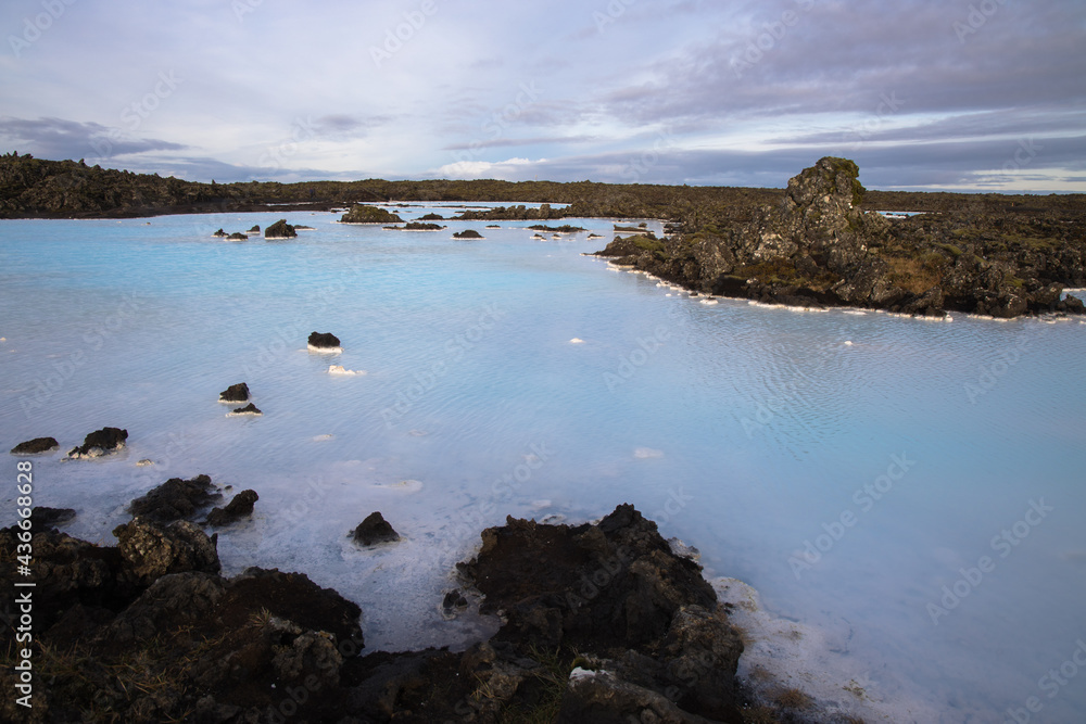 Views of moss covered lava fields and milky blue waters near the Blue Lagoon, Iceland
