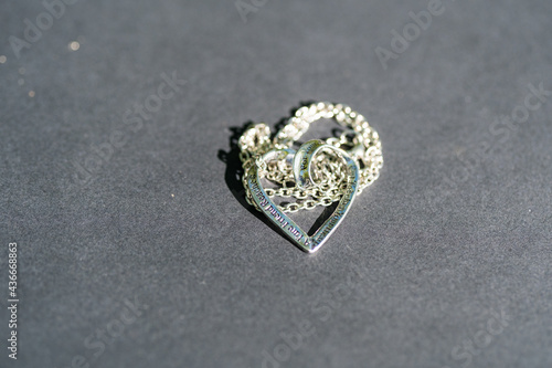Heart pendant necklace symbol of love Romance Valentine's Day Closeup shoot in a summer day. Selective Focus. High quality photo
