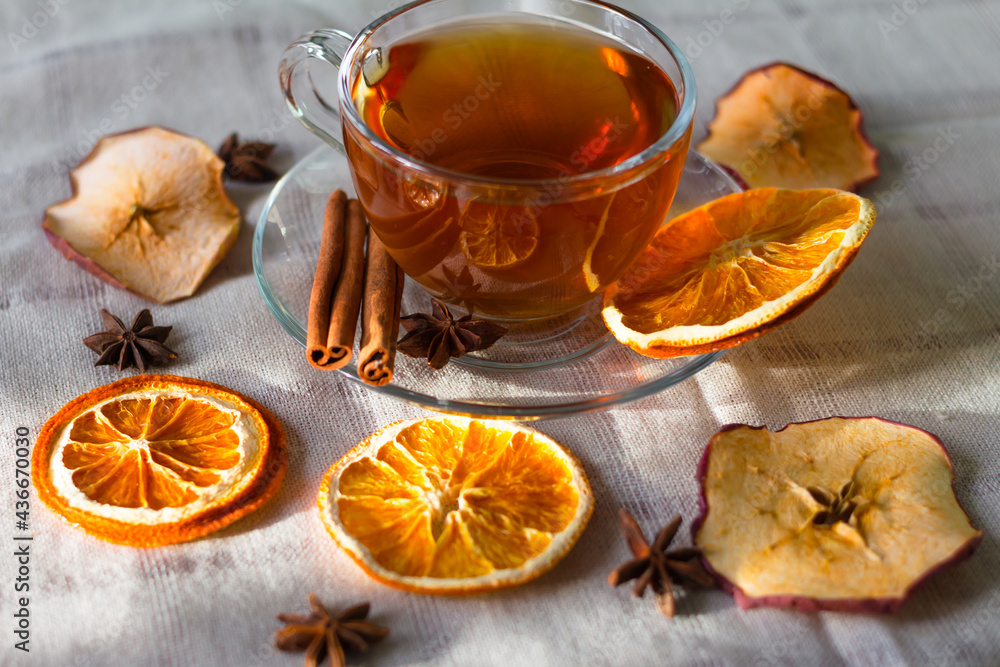 Cup of tea and slices of dried orange Cup of tea and slices of dried orange