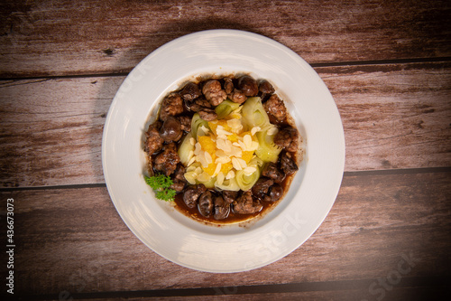 Recipe of sweetbread and lamb kidney with cocoa, leek whistles with almonds and oranges. High quality photo photo