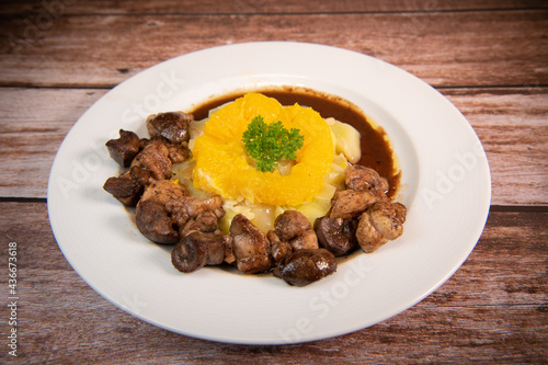 Recipe of sweetbread and lamb kidney with cocoa, leek whistles with almonds and oranges. High quality photo photo