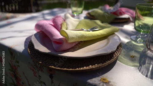 White napkins with pink and light green edges,