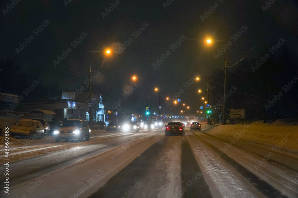 Cars in traffic in winter in the evening dark Cars in traffic in winter in the evening dark