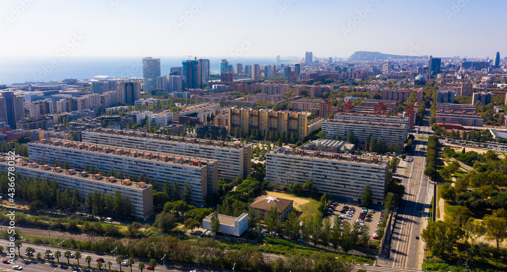 Aerial view of new residential complex of Diagonal Mar i el Front Maritim del Poblenou on sunny fall day, Barcelona, Spain