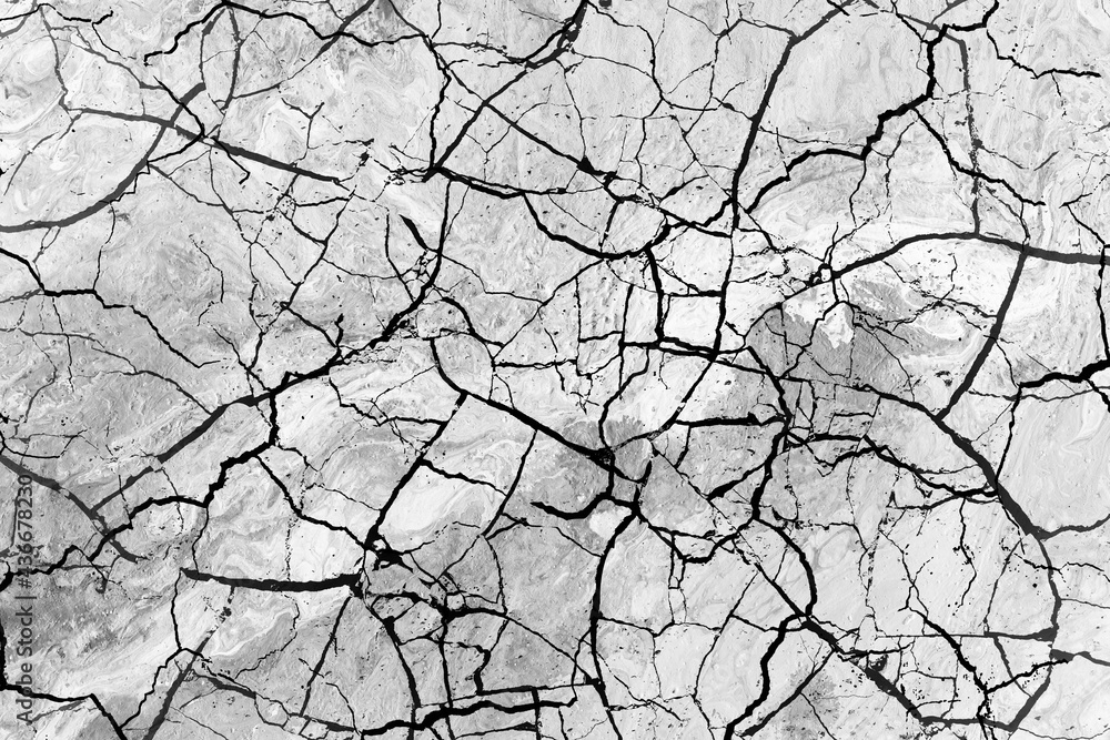 Fototapeta premium Stone crackle effect paper background. Gray monochrome texture.