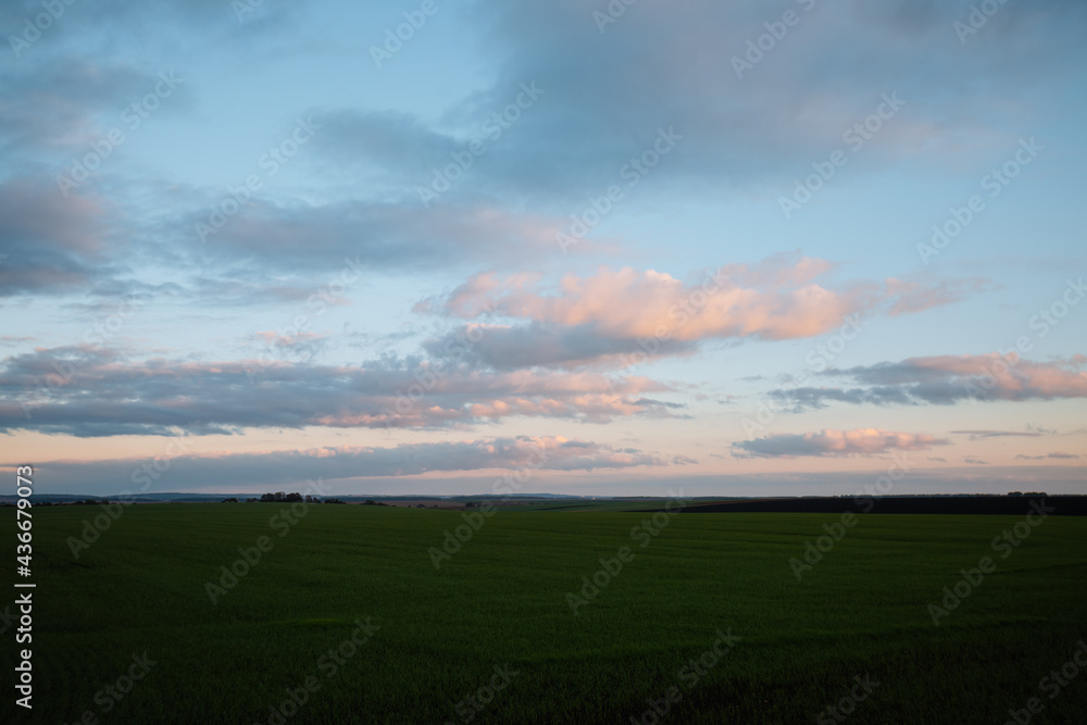 Attractive evening sky of agrarian land. Fresh vibrant colors.