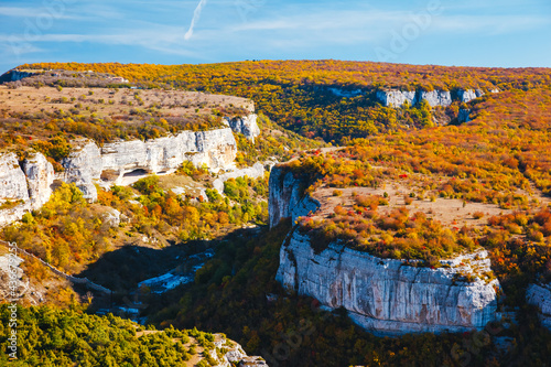 Panoramic mountain view of the plateau Besh-Kosh in sunny day. Chufut-Kale cave city, Crimean Mountains, Bakhchisaray. photo