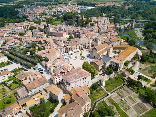 Aerial view of historic centre of Besalu with Romanesque bridge over Fluvia river, Catalonia, Spain