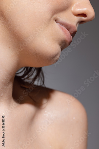 Wallpaper Mural Cropped portrait of young sensual beautiful girl posing isolated on grey studio background. Concept of beauty, cosmetics, spa. Torontodigital.ca