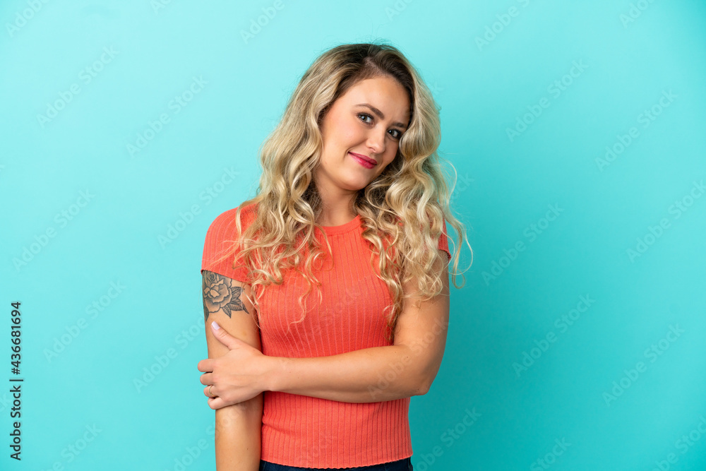 Young Brazilian woman isolated on blue background laughing Young Brazilian woman isolated on blue background laughing