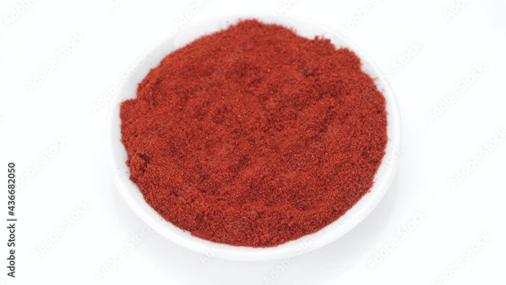 sweet smoked paprika top view isolated on white background. 4K UHD video sweet smoked paprika top view isolated on white background. 4K UHD video