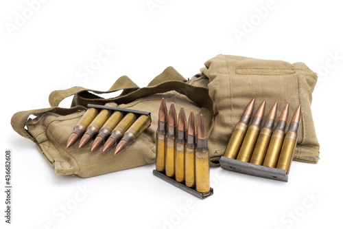 Military bandolier and 7.62 Nato ammunition on white.