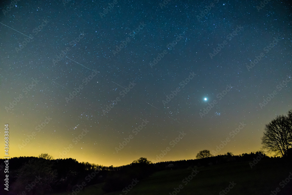 Germany, Starry night sky in summer season with endless stars lighting up the sky in nature of schwarzwald