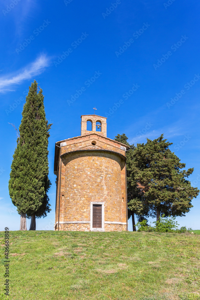 Chapel on a hill against the blue sky