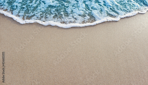 Beautiful sandy beach background and waves concept background for text input.