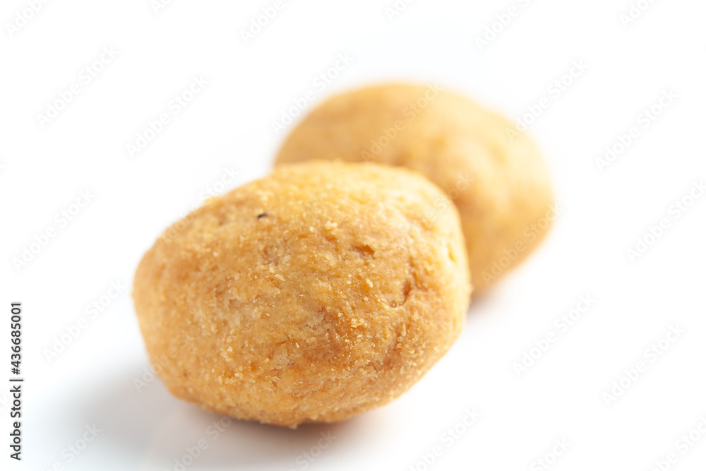 Close-up of freshly baked spicy Dry kachori or crunchy balls filled with spicy dry chutney traditionally authentic Rajisthani and Gujrati. Isolated over studio white background