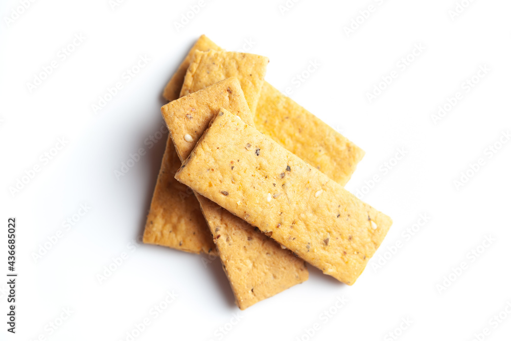 Close-up of freshly baked spicy and salted Mathri or matthi, traditionally authentic Rajisthani . Isolated over studio white background Close-up of freshly baked spicy and salted Mathri or matthi, traditionally authentic Rajisthani . Isolated over studio white background