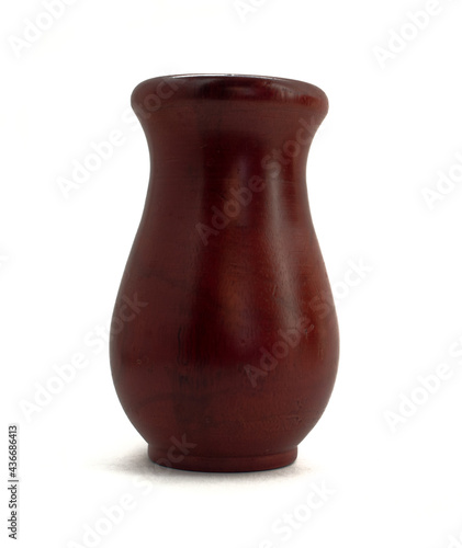 Brown wooden jug isolated on a white background.