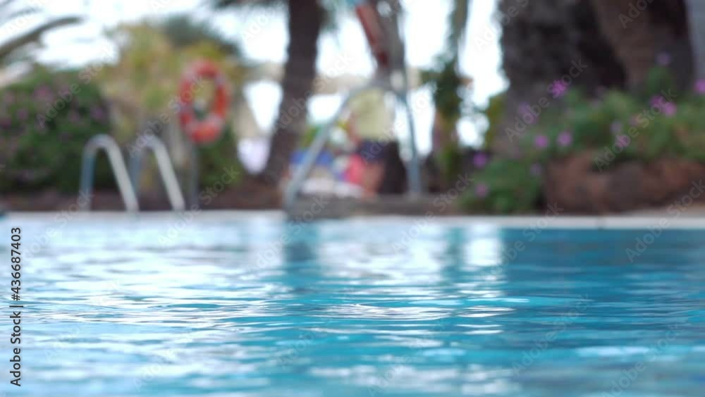 Water in the swimming pool in tropical resort in slow motion 120fps Water in the swimming pool in tropical resort in slow motion 120fps