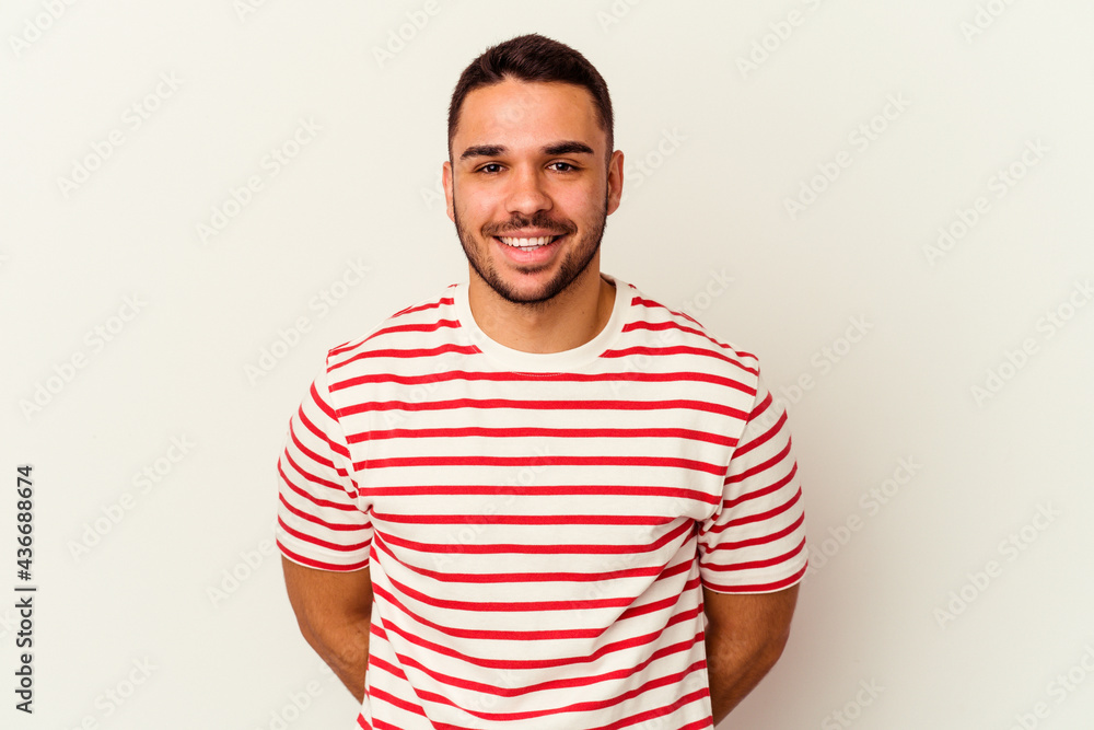 Obraz premium Young caucasian man isolated on white background happy, smiling and cheerful.
