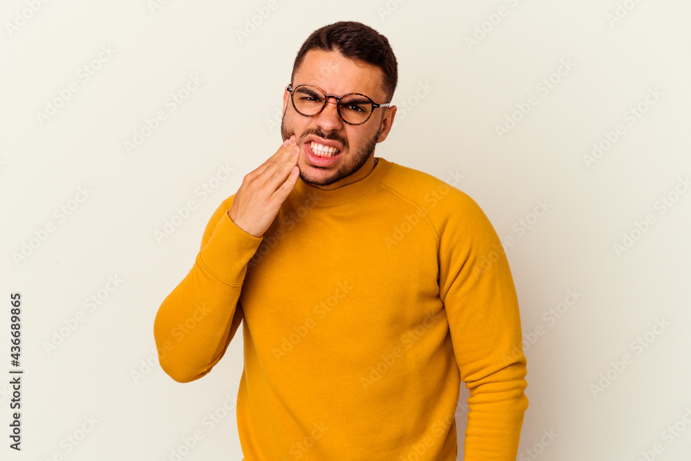 Young caucasian man isolated on white background having a strong teeth pain, molar ache. Young caucasian man isolated on white background having a strong teeth pain, molar ache.