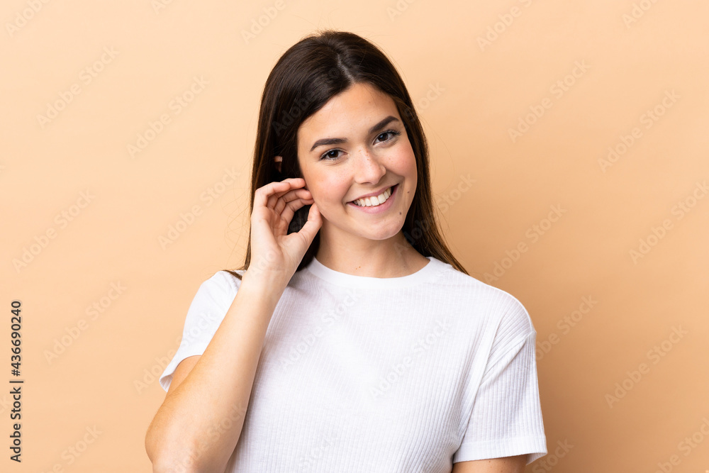 Teenager Brazilian girl over isolated background laughing Teenager Brazilian girl over isolated background laughing