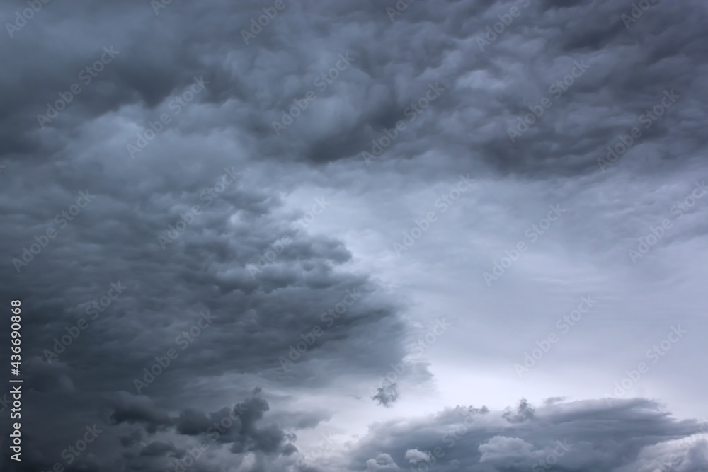 Dramatic thunderstorm clouds background at dark sky Dramatic thunderstorm clouds background at dark sky
