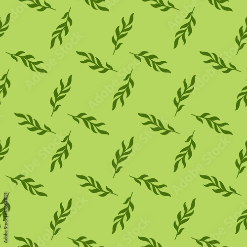 Hand drawn leaves twig silhouettes seamless pattern in doodle style. Green geometric style artwork.