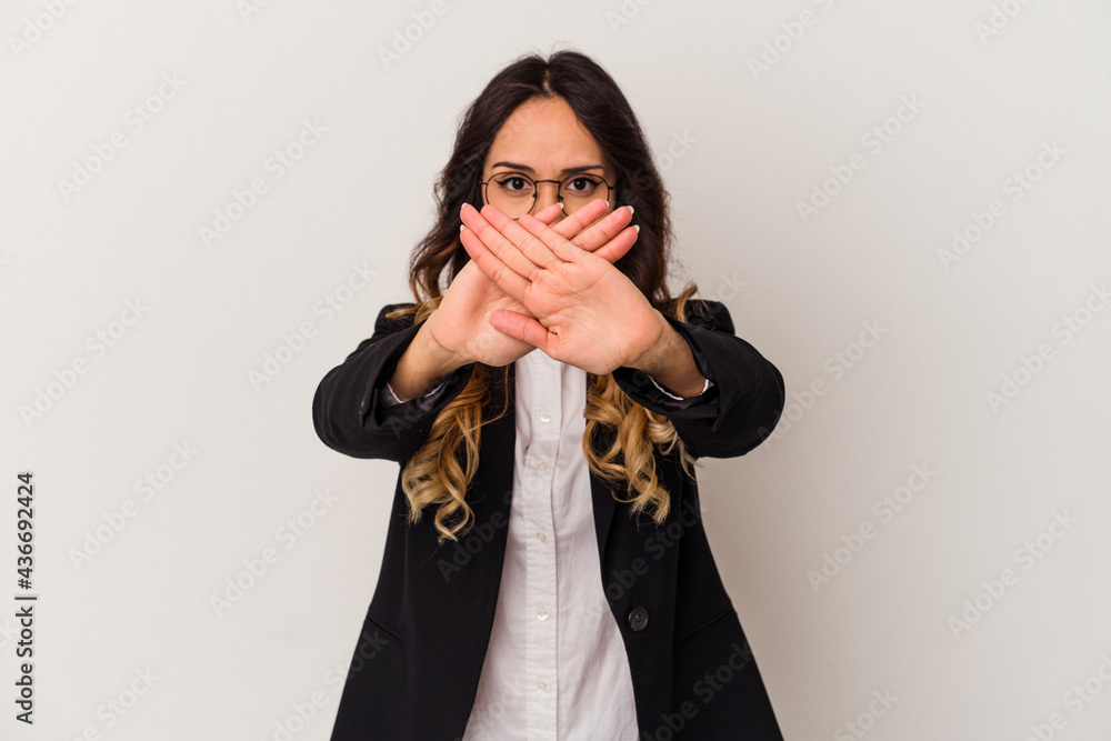 Young mexican business woman isolated on white background doing a denial gesture Young mexican business woman isolated on white background doing a denial gesture
