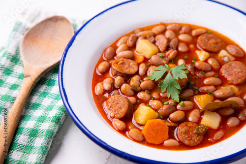 Beans with chorizo. Traditional tapa from the north of Spain in the Asturias region.