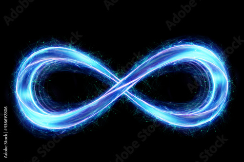 infinity sign hologram in blue isolated on dark background