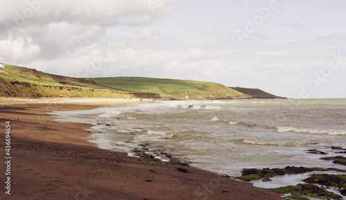 Landscape shot off beach with soft hills in the background