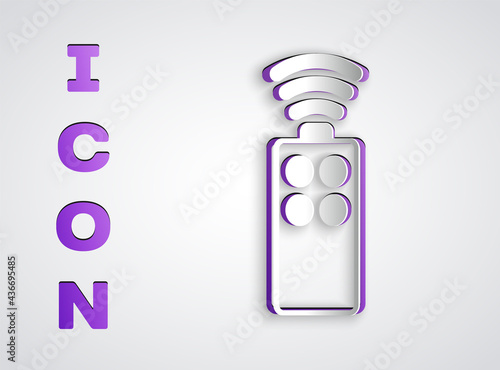 Paper cut Remote control for the camera icon isolated on grey background. An auxiliary device that allows you to work with a camera from a distance. Paper art style. Vector