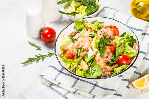 Seafood salad with fresh leaves, tomatoes and shrimps. Mediterranean diet.