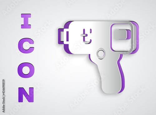 Paper cut Digital contactless thermometer with infrared light icon isolated on grey background. Paper art style. Vector