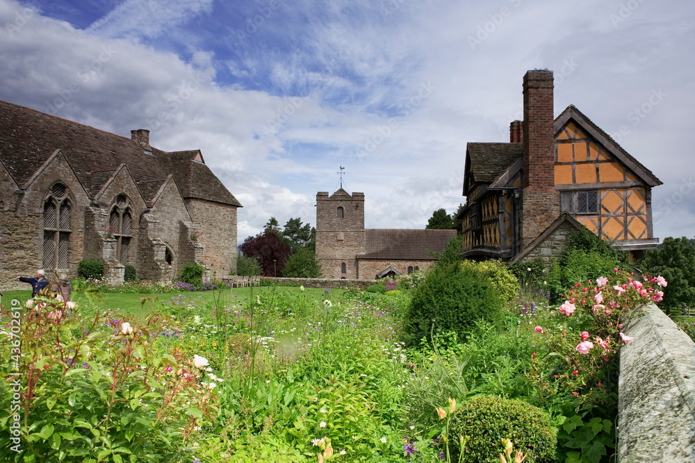 The inner courtyard, Great Hall, church and gatehouse of circa 1641, seen from across the glorious flowerbeds, Stokesay Castle, Shropshire