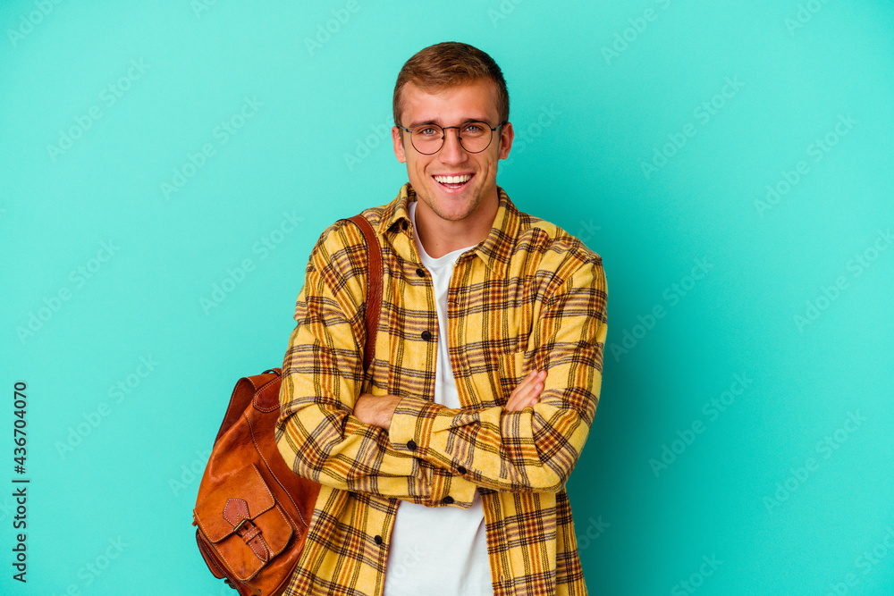 Young caucasian student man isolated on blue background Young caucasian student man isolated on blue background